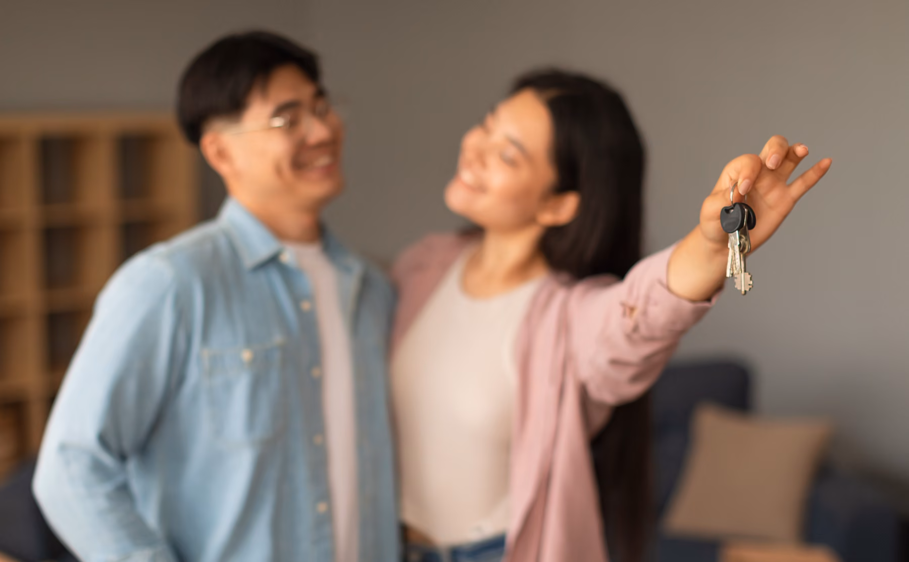 Homebuyers receiving keys to a new home