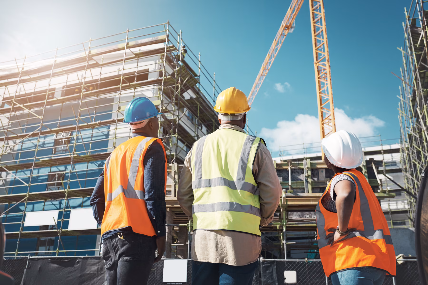 Construction specialists reviewing a multi-residential development site