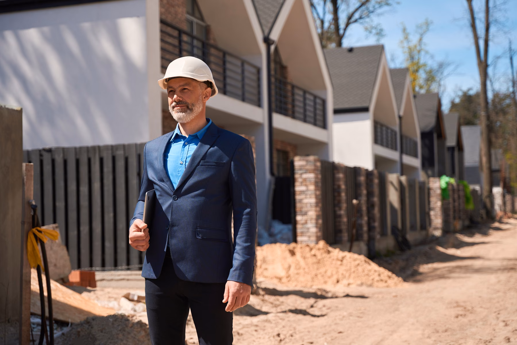 Construction manager reviewing a townhouse project